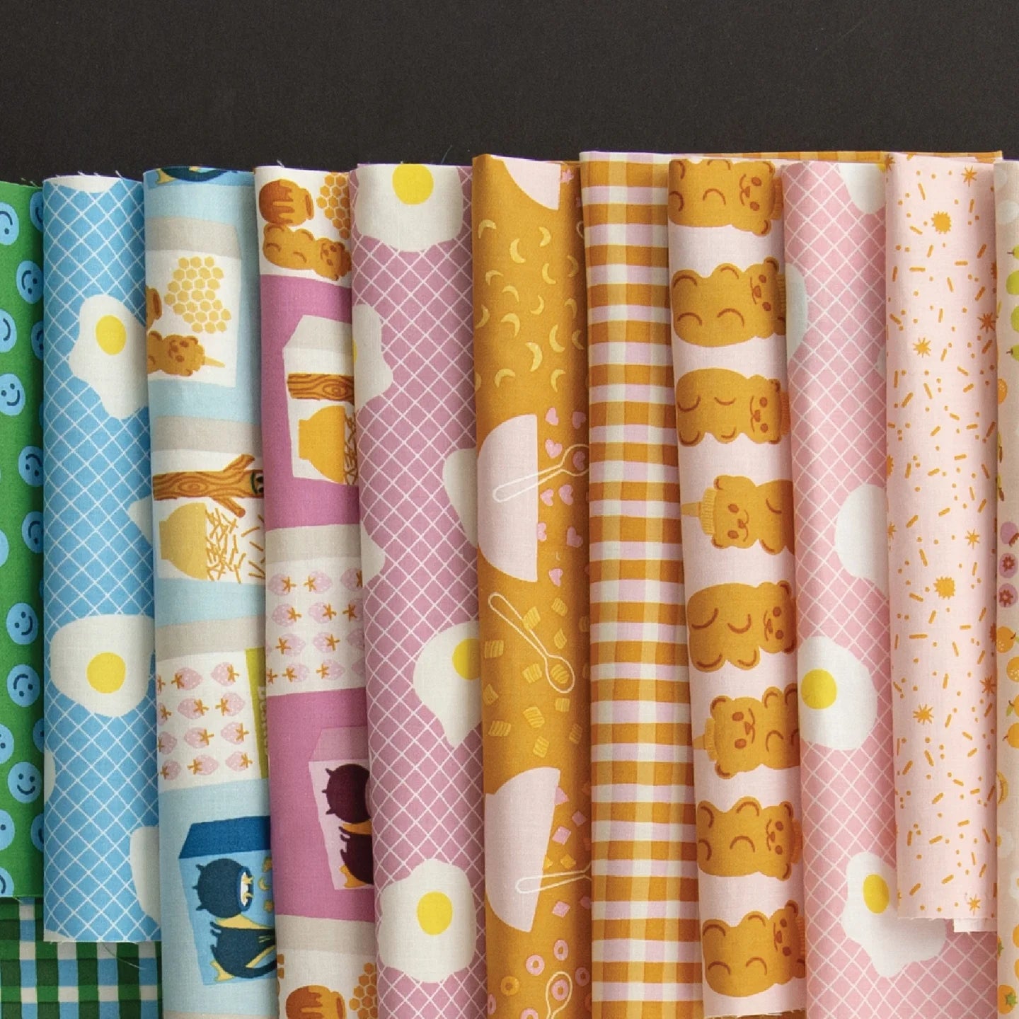 Egg and Friends | Features fun, breakfast-themed prints perfect for playful quilts and sewing.
