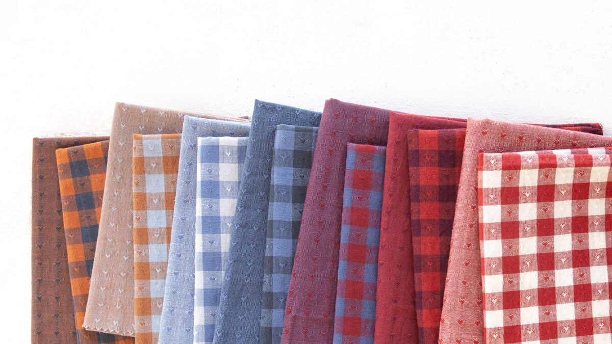 Dobby Hearts | features textured heart-patterned fabrics, perfect for quilts and sewing projects with a romantic or playful touch.